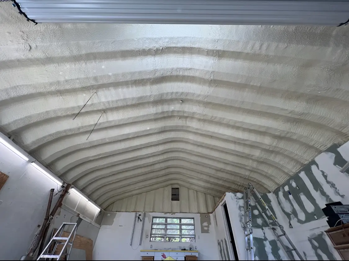 Spray polyurethane foam applied to the underside of a metal roof deck in New River